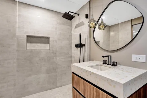 a living room with furniture and wall paintings