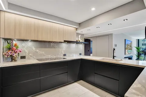 a kitchen with a sink and cabinets