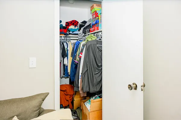 a close view of a sink storage and a refrigerator