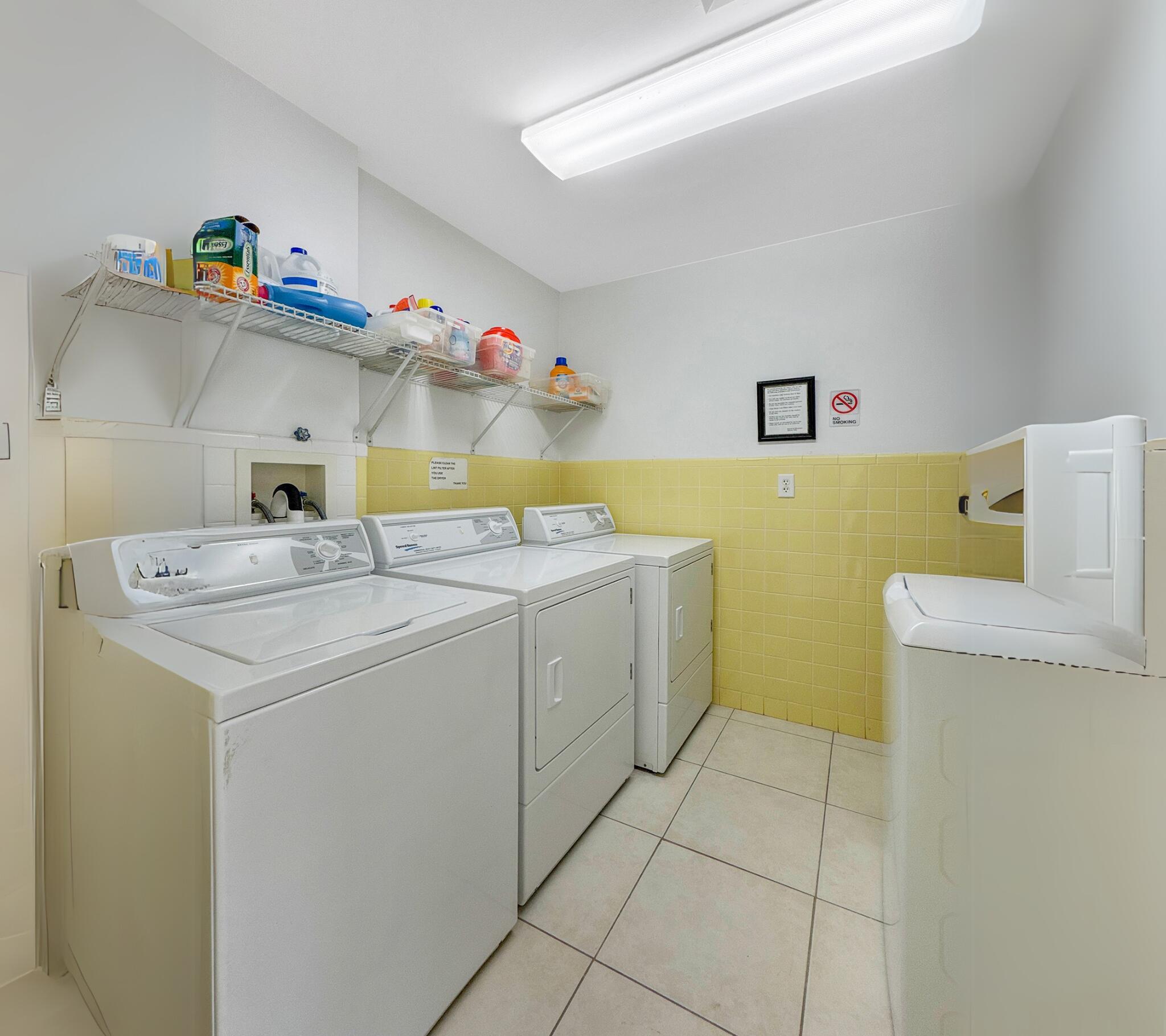 350 South Beach Road, Unit 503 Tequesta, FL 33469 - Photo 39 of 51 a utility room with dryer and washer