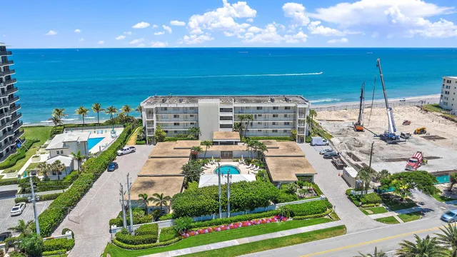a view of a balcony with chairs and a table