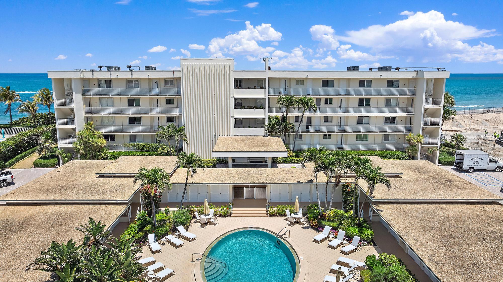 350 South Beach Road, Unit 503 Tequesta, FL 33469 - Photo 6 of 51 a front view of building with outdoor space and seating
