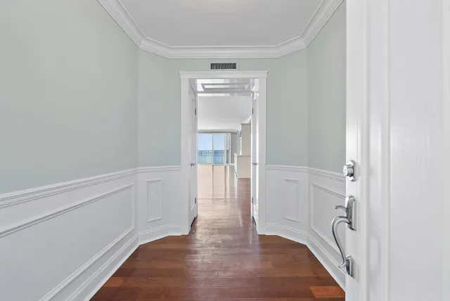 a view of hallway with wooden floor