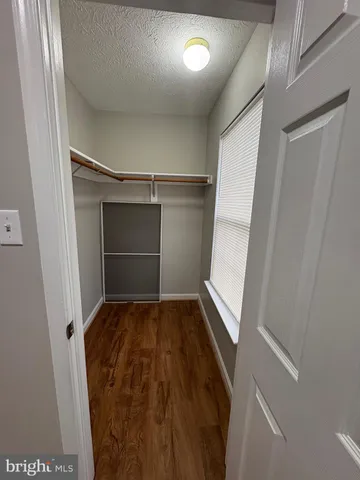 a view of an empty walk in closet