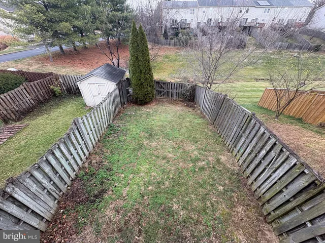 a view of a backyard with sitting area