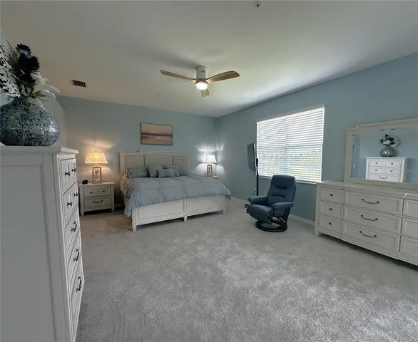 a bed room with furniture and a bed