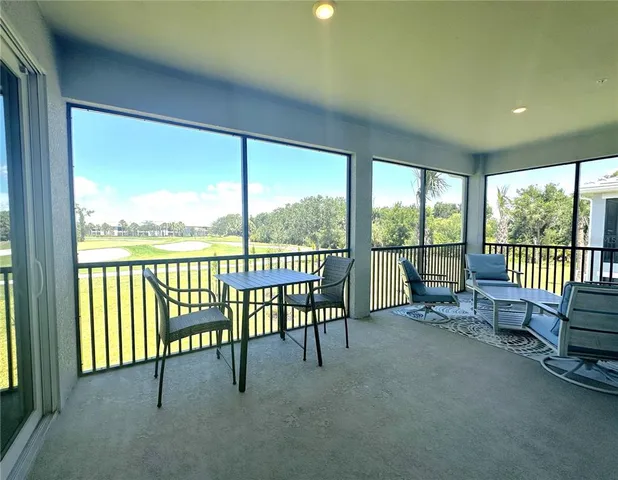 a view of a room with yard from balcony