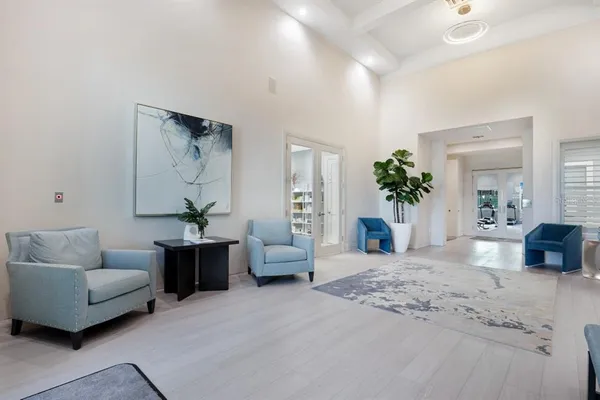 a view of a livingroom with hardwood and furniture