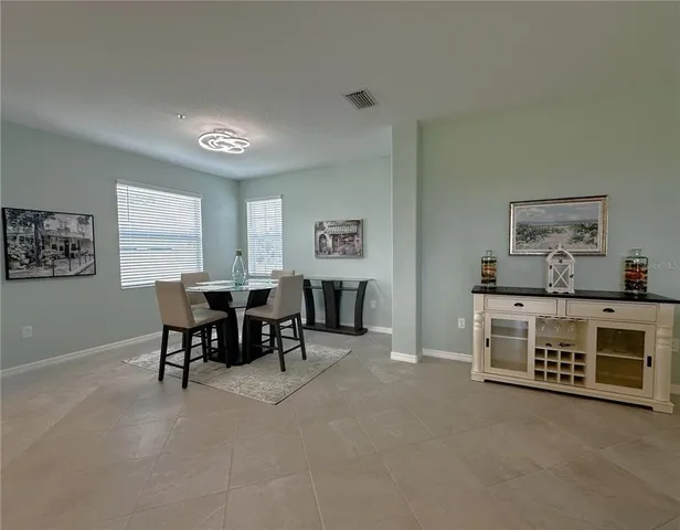 a view of a livingroom with furniture and a window
