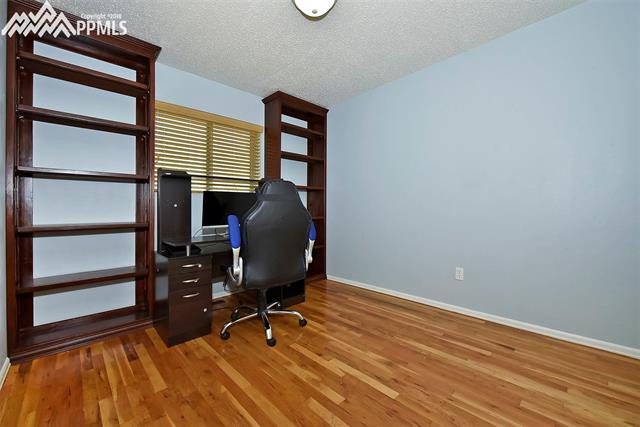 1235 Osgood Road Colorado Springs, CO 80915 - Photo 11 of 17 Bedroom 3 with built in shelves located next to bedroom 2 Upstairs!