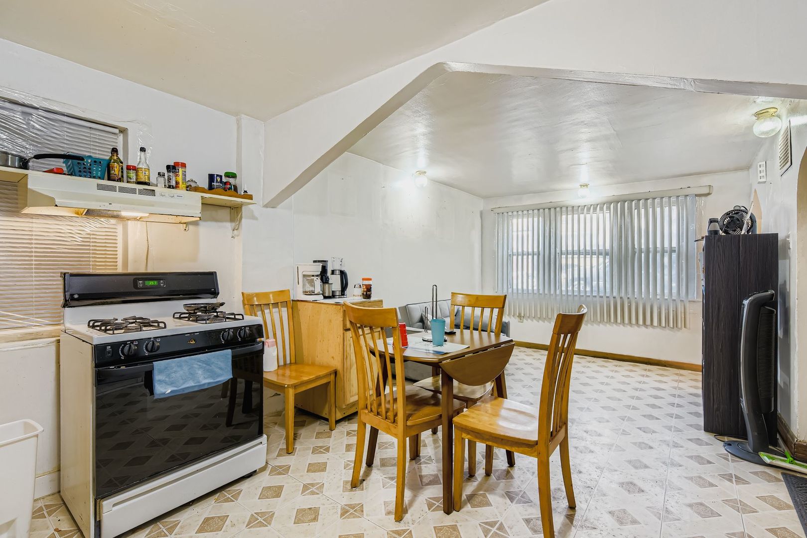 2453 South Trumbull Avenue Chicago, IL 60623 - Photo 13 of 21 a dining room with furniture and a fireplace