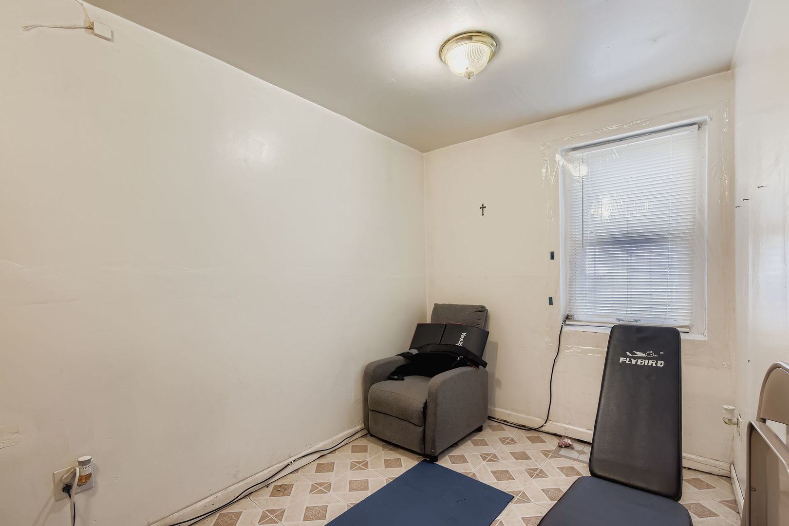 2453 South Trumbull Avenue Chicago, IL 60623 - Photo 17 of 21 an empty room with wooden floor and windows