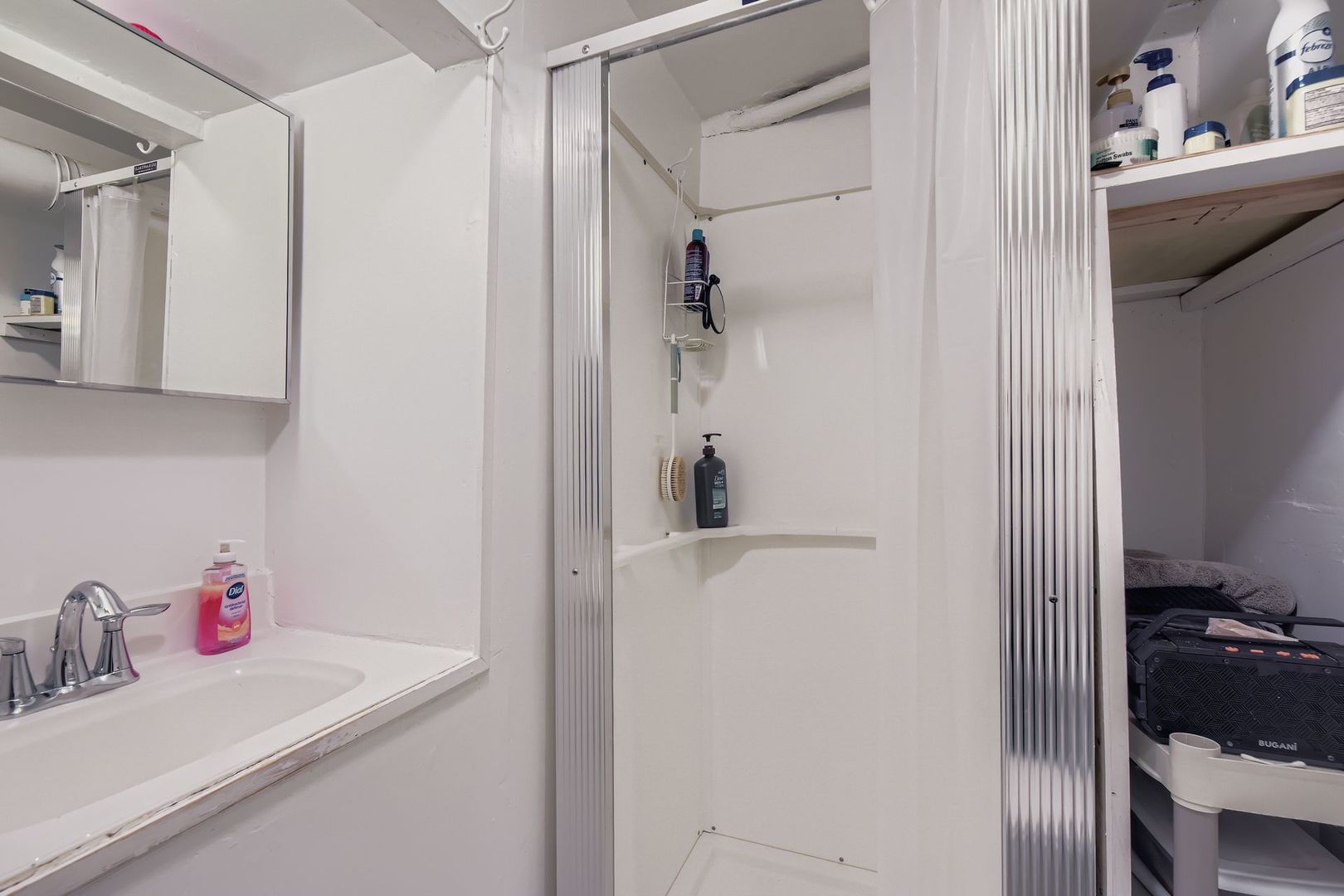 2453 South Trumbull Avenue Chicago, IL 60623 - Photo 19 of 21 a bathroom with a sink and a mirror