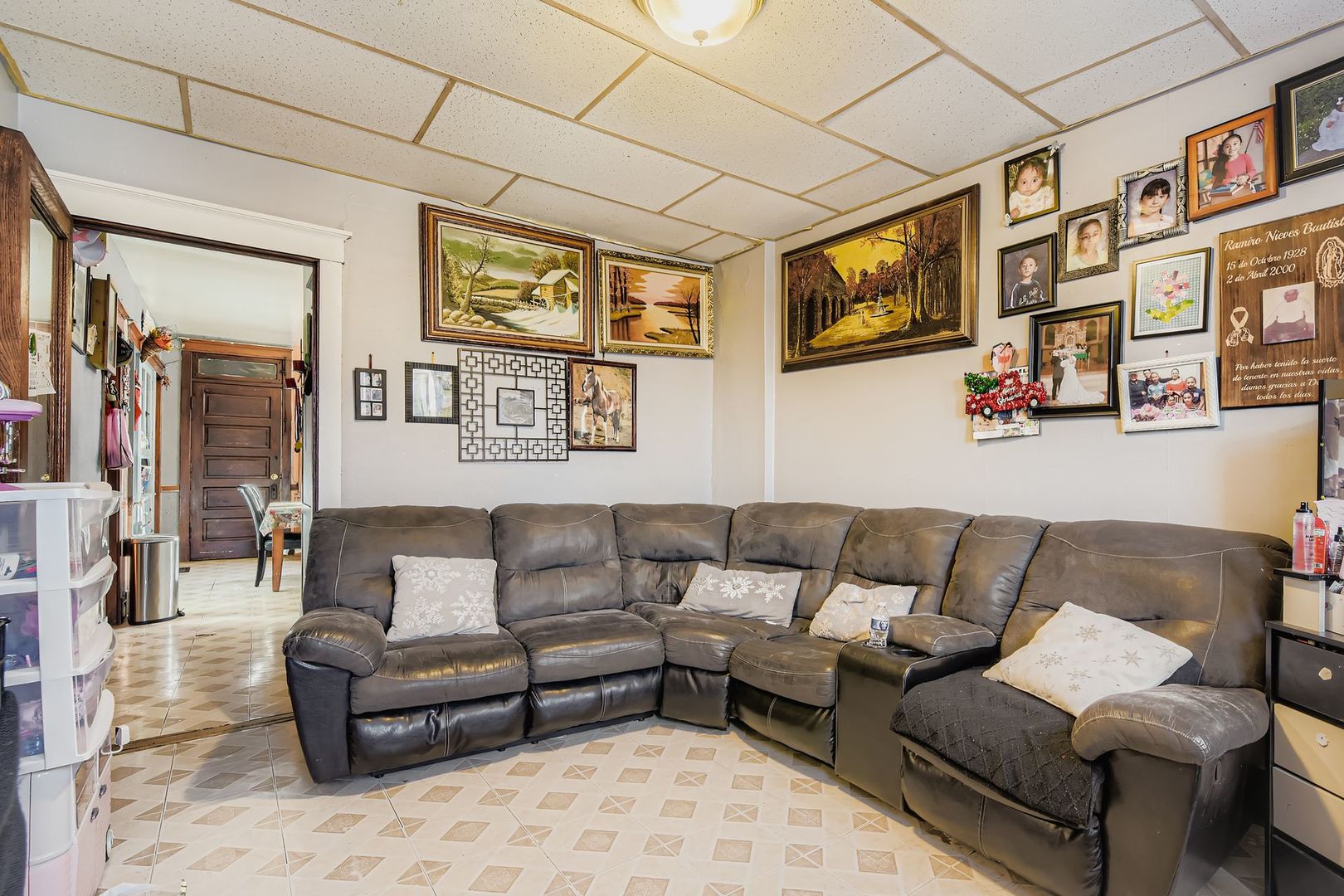 2453 South Trumbull Avenue Chicago, IL 60623 - Photo 4 of 21 a living room with furniture a couch and paintings on the wall