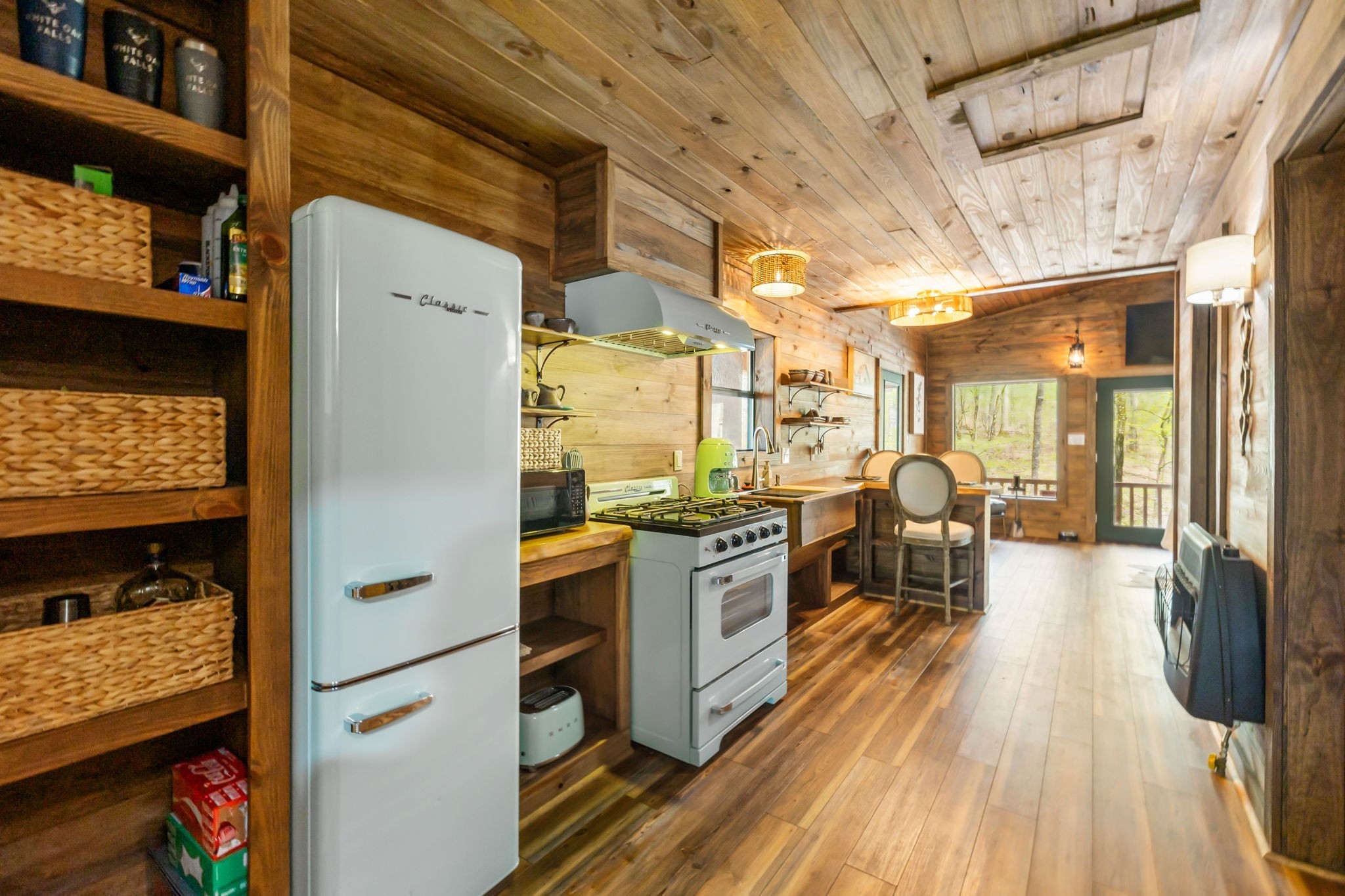 3105 Coy Hill Road Olivehill, TN 38475 - Photo 64 of 95 a kitchen with stainless steel appliances granite countertop a refrigerator a stove and a wooden floors