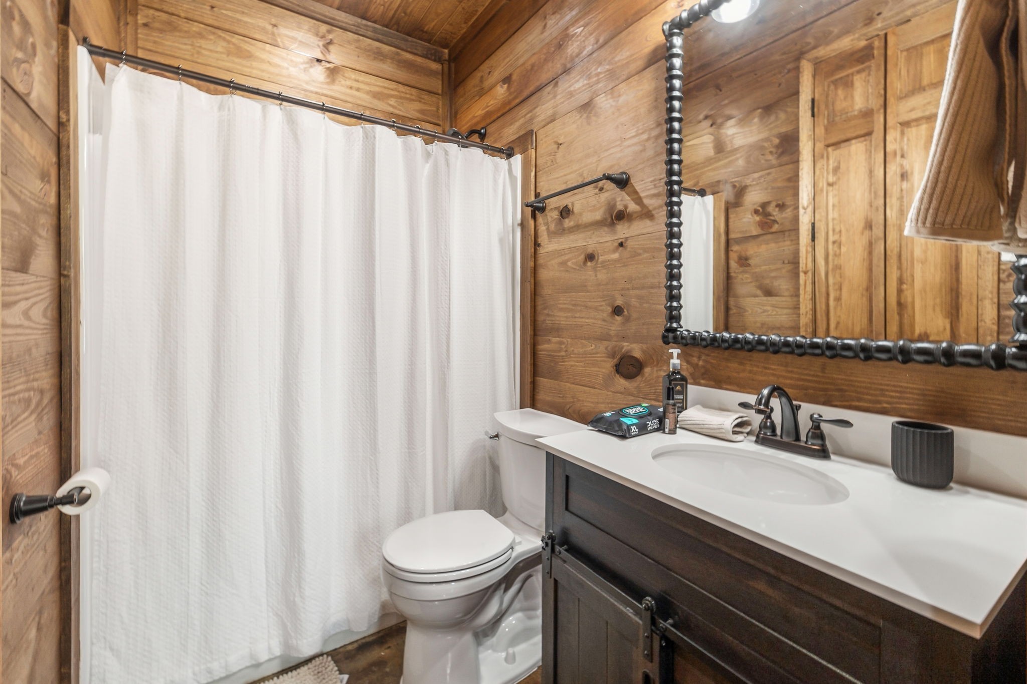 3105 Coy Hill Road Olivehill, TN 38475 - Photo 77 of 95 a bathroom with a sink a toilet and shower curtain