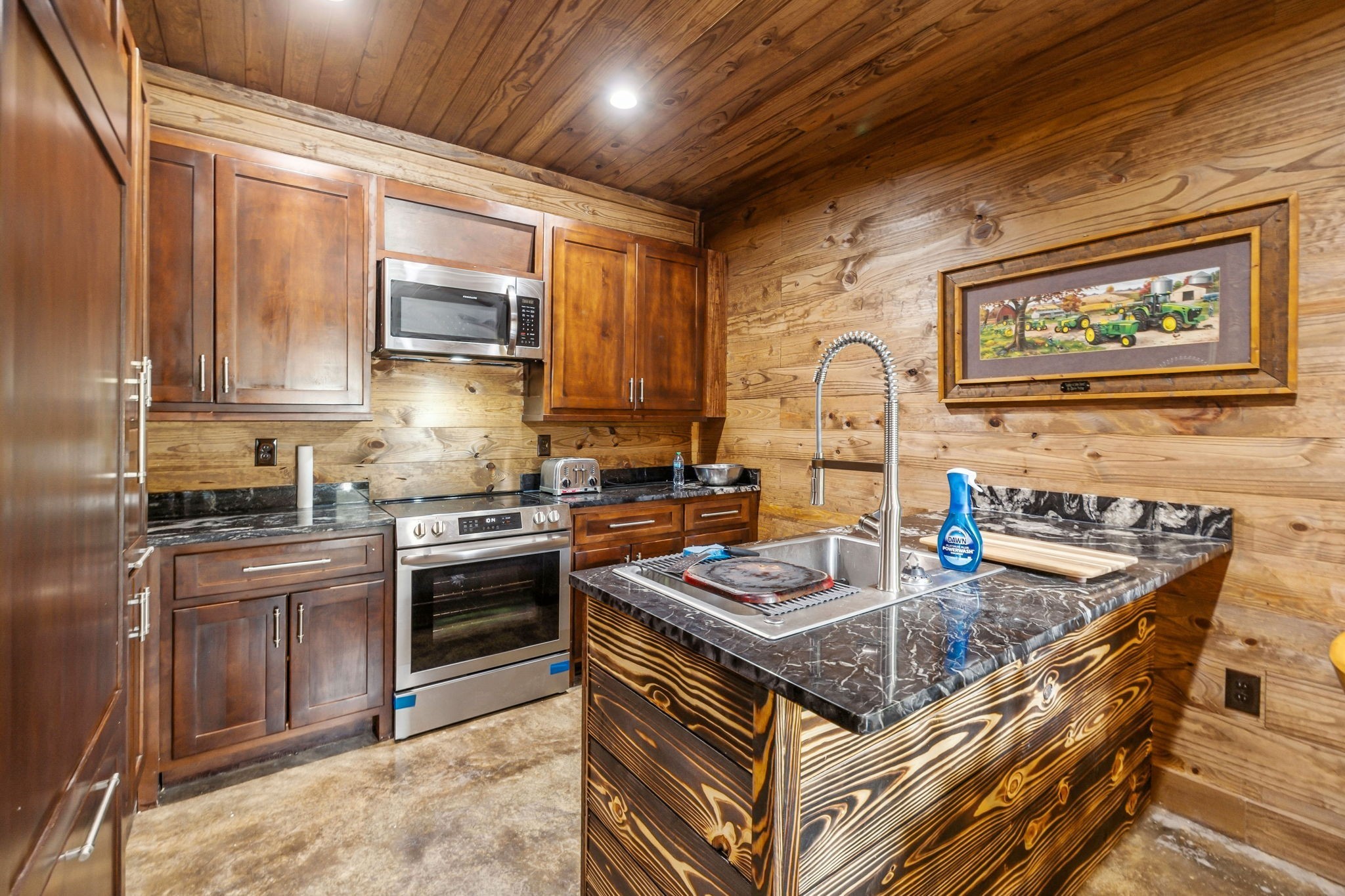 3105 Coy Hill Road Olivehill, TN 38475 - Photo 79 of 95 a kitchen with stainless steel appliances granite countertop a stove sink and cabinets