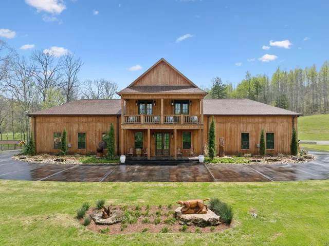a dining hall with stainless steel appliances granite countertop a sink and a granite counter tops with a large window