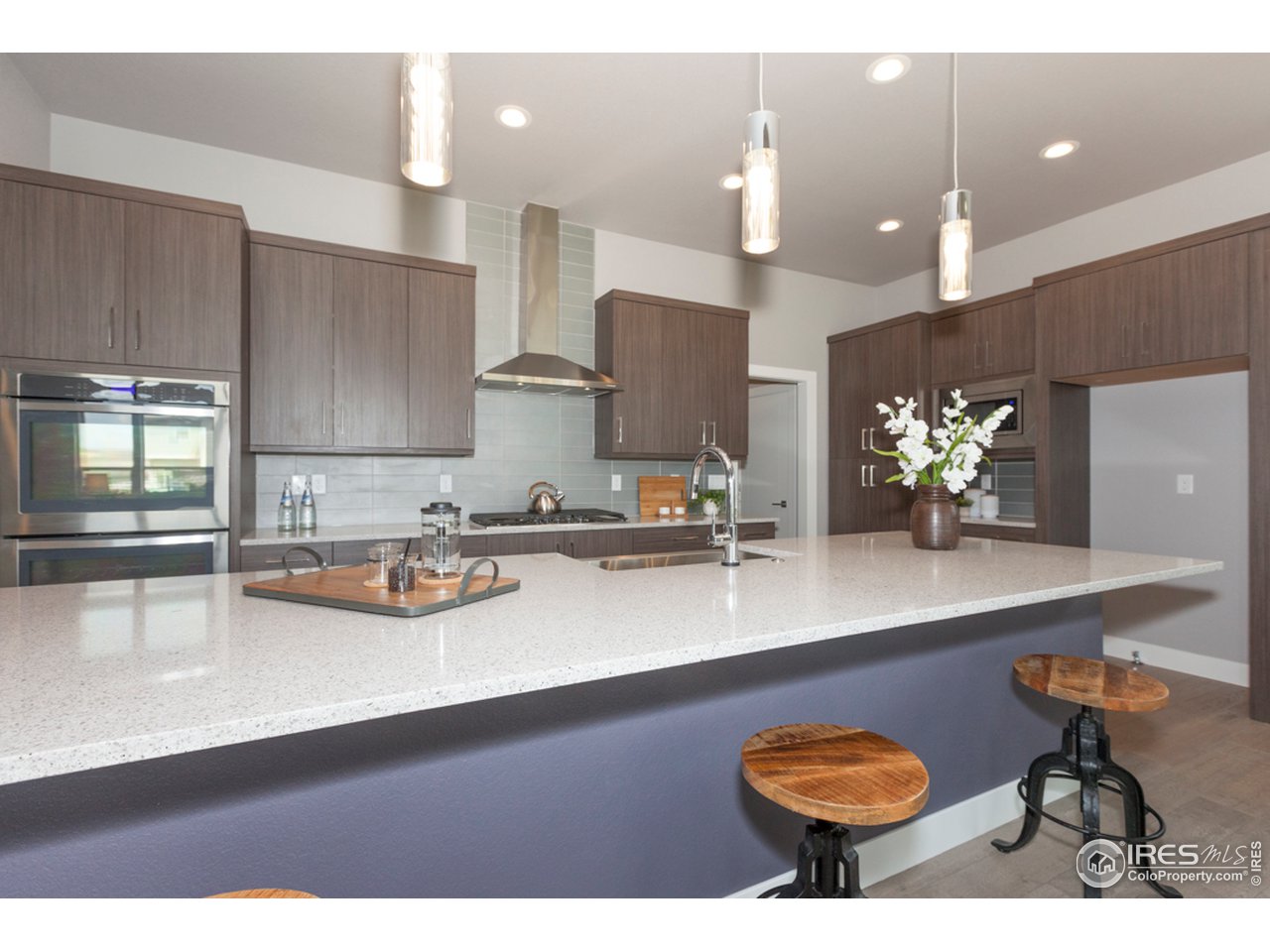 3818 Bridle Ridge Circle Fort Collins, CO 80524 - Photo 12 of 40 a kitchen with sink and view of living room
