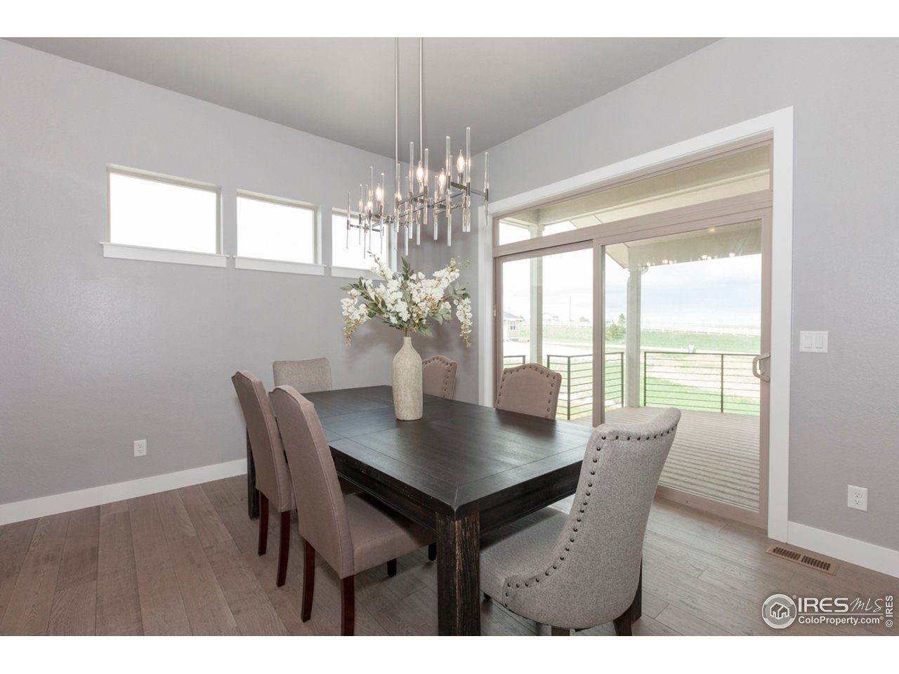 3818 Bridle Ridge Circle Fort Collins, CO 80524 - Photo 15 of 40 a view of a dining room with furniture window and outside view