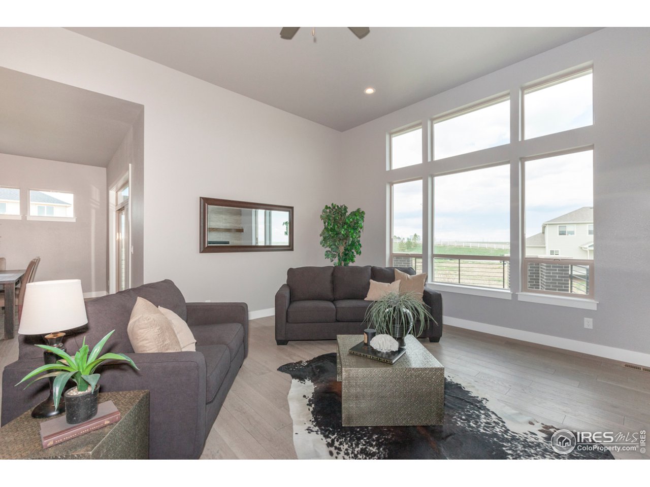 3818 Bridle Ridge Circle Fort Collins, CO 80524 - Photo 16 of 40 a living room with furniture and a large window