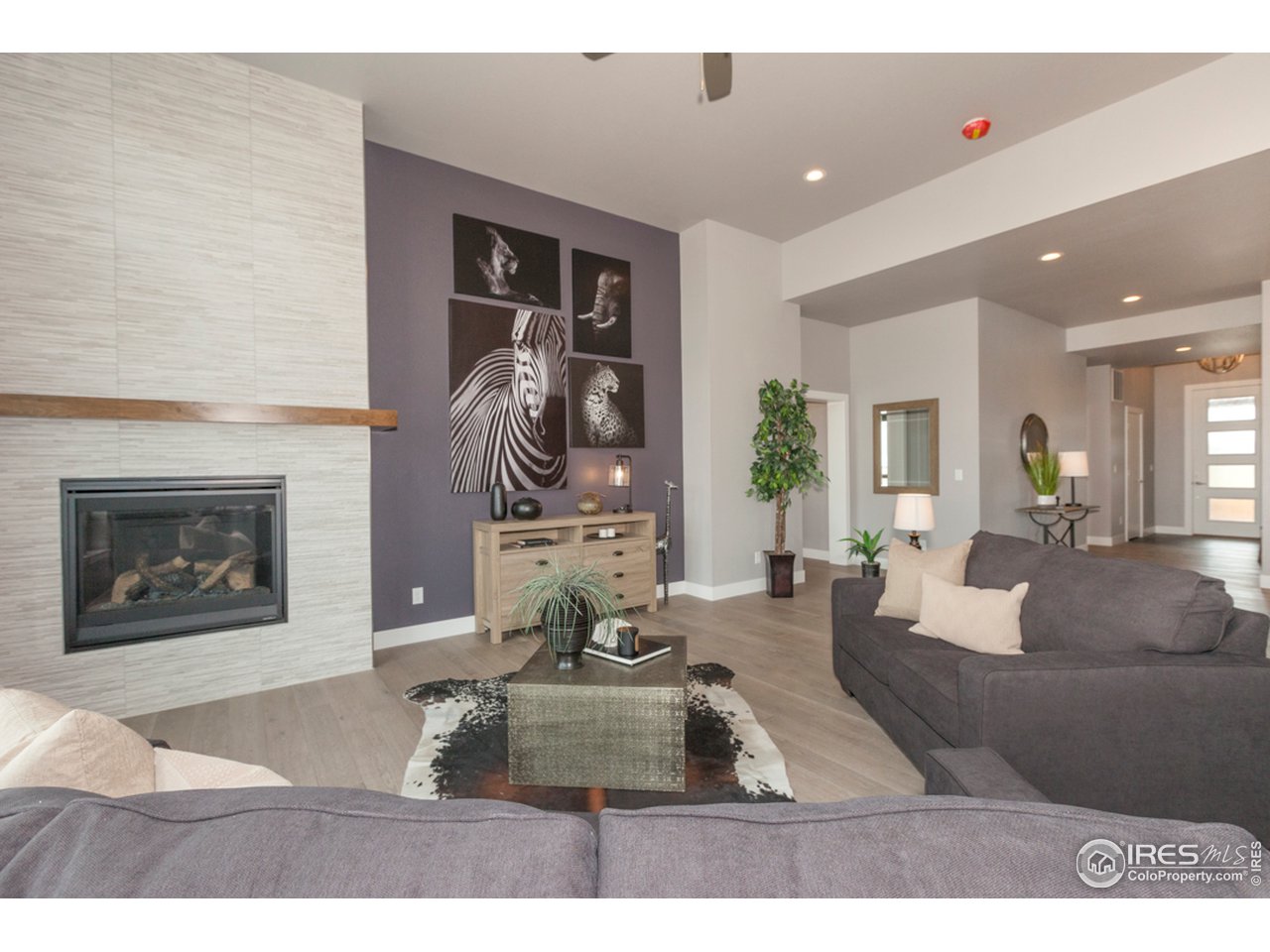 3818 Bridle Ridge Circle Fort Collins, CO 80524 - Photo 18 of 40 a living room with furniture and a fireplace