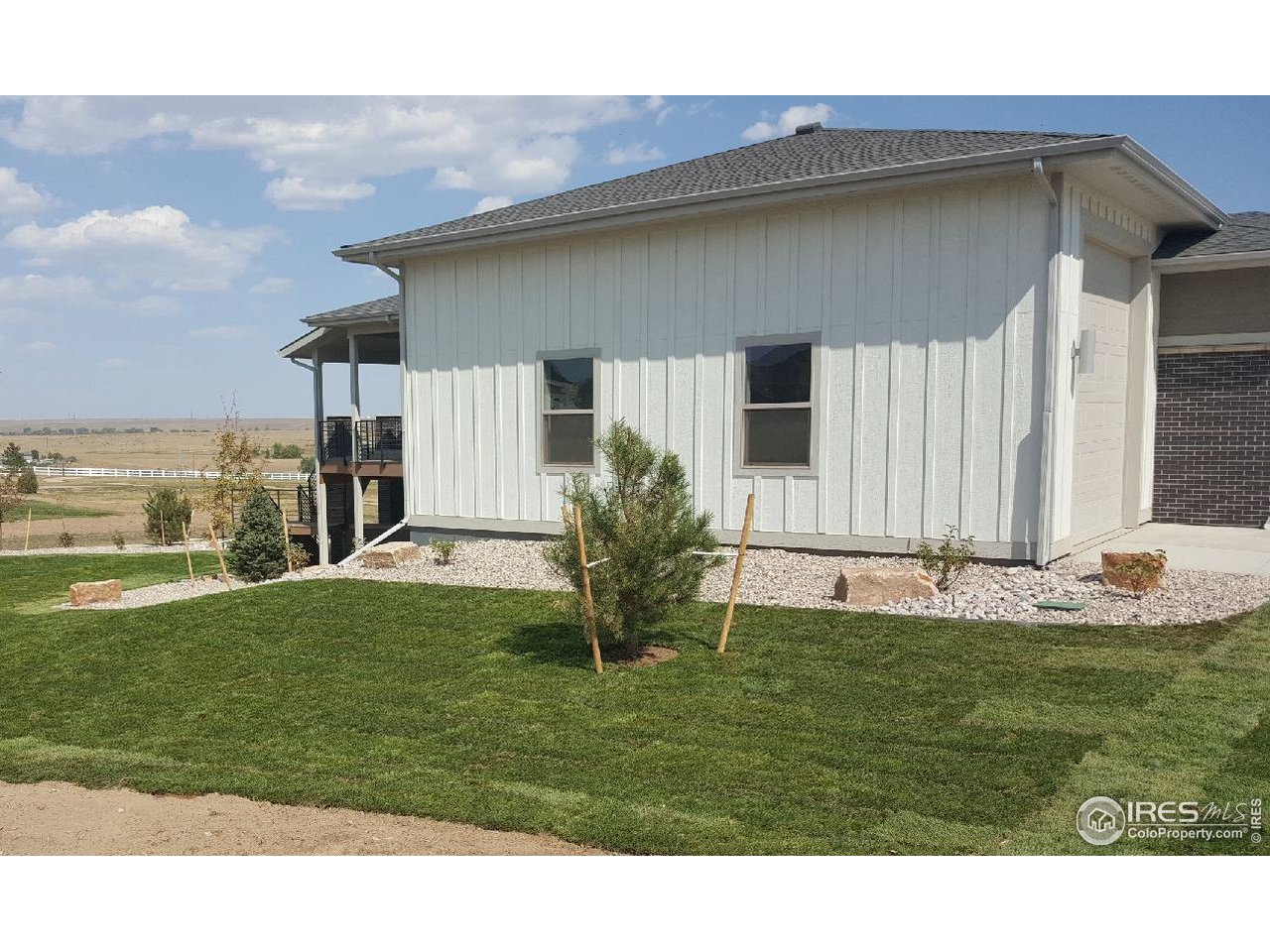 3818 Bridle Ridge Circle Fort Collins, CO 80524 - Photo 2 of 40 a backyard of a house with lots of green space