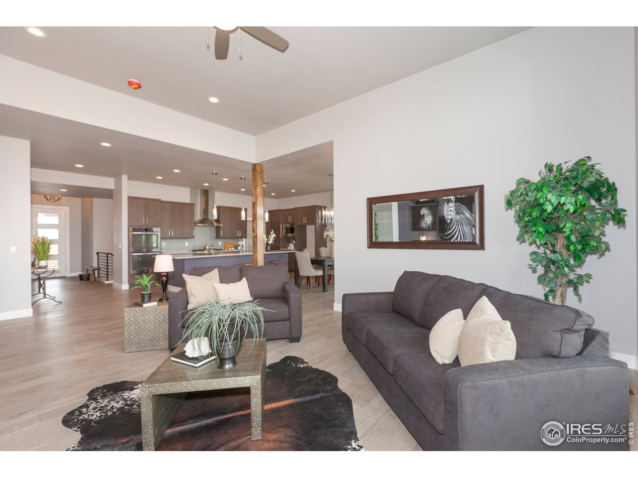 3818 Bridle Ridge Circle Fort Collins, CO 80524 - Photo 19 of 40 a living room with furniture and a table