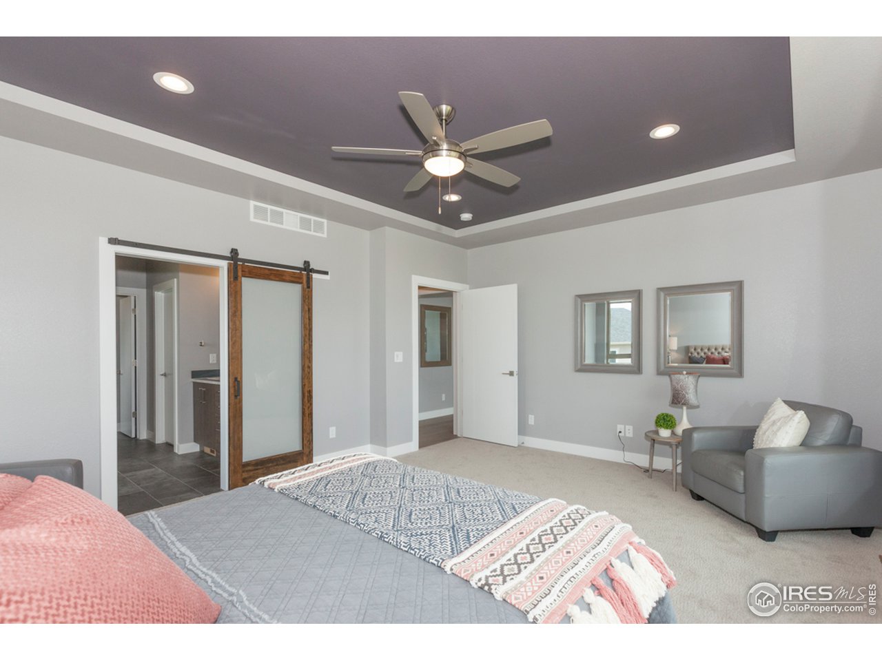 3818 Bridle Ridge Circle Fort Collins, CO 80524 - Photo 22 of 40 a bedroom with a bed and a couch