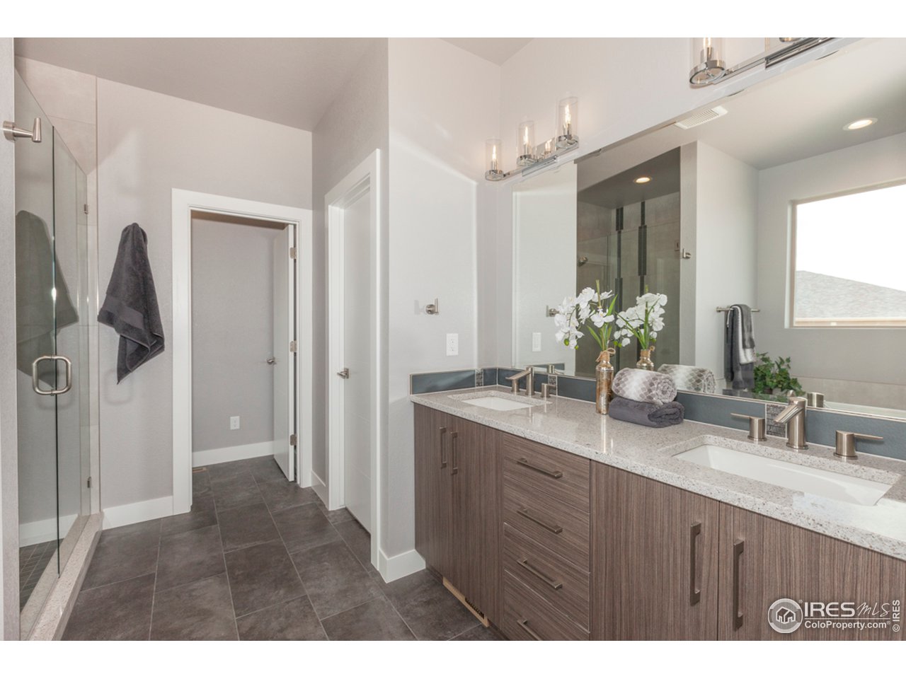 3818 Bridle Ridge Circle Fort Collins, CO 80524 - Photo 24 of 40 a bathroom with a sink and a mirror