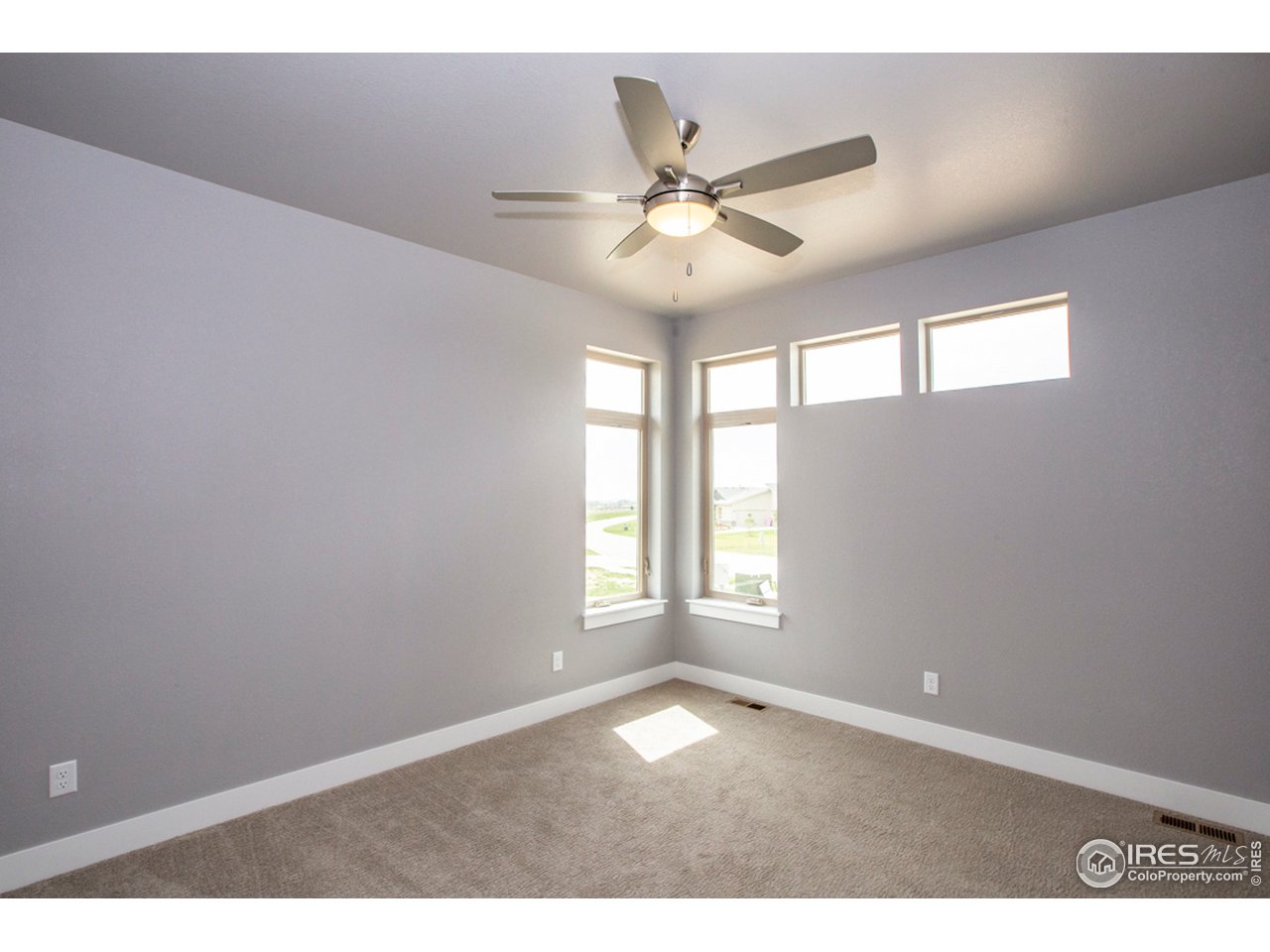 3818 Bridle Ridge Circle Fort Collins, CO 80524 - Photo 25 of 40 a view of an empty room with a window