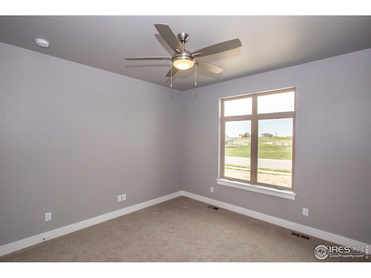 3818 Bridle Ridge Circle Fort Collins, CO 80524 - Photo 27 of 40 a view of an empty room with a window