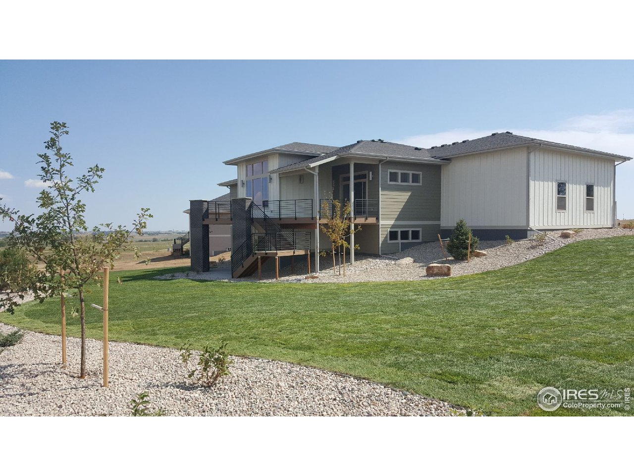 3818 Bridle Ridge Circle Fort Collins, CO 80524 - Photo 3 of 40 a house view with a garden space