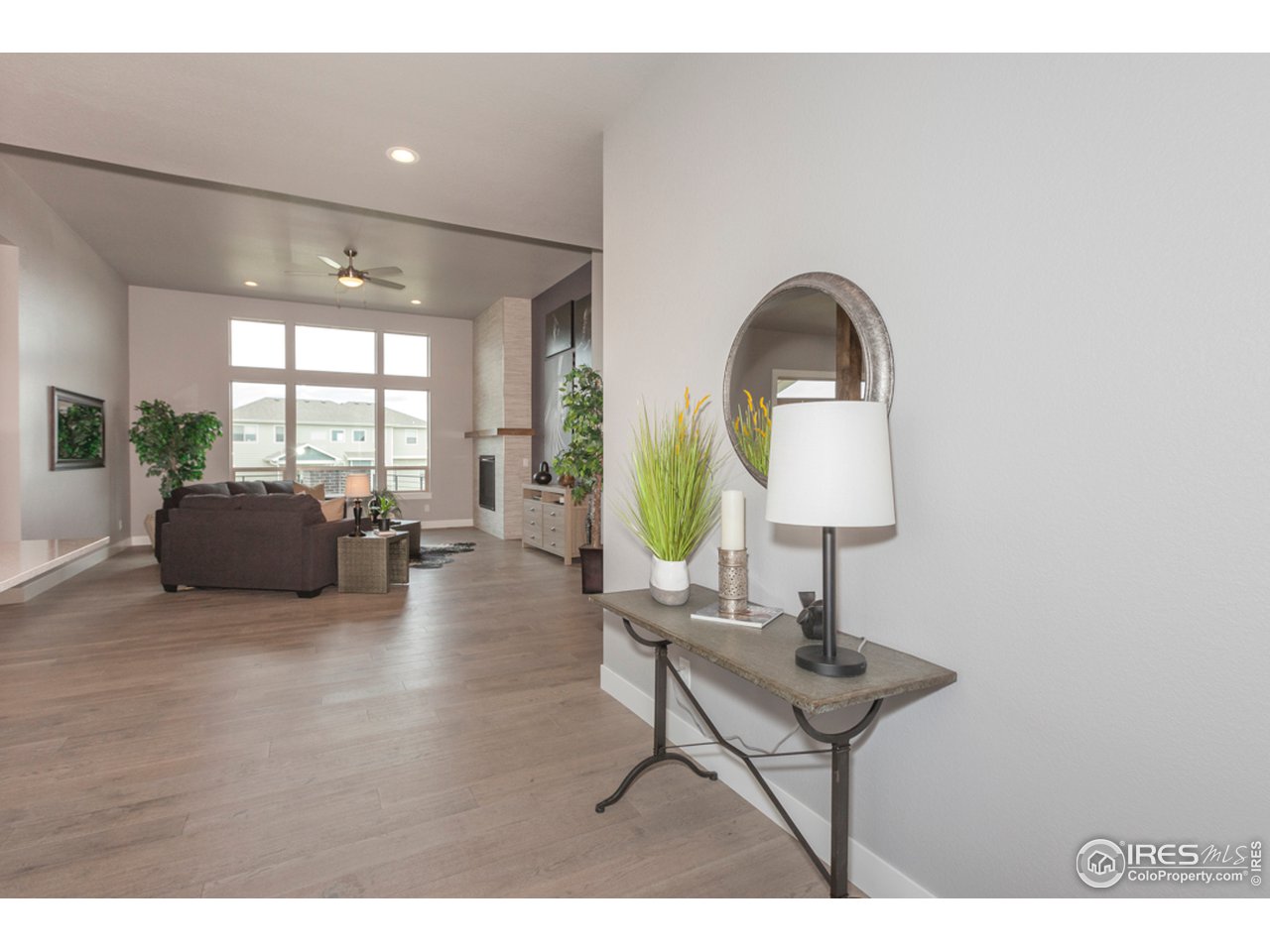 3818 Bridle Ridge Circle Fort Collins, CO 80524 - Photo 6 of 40 a living room with furniture and a window