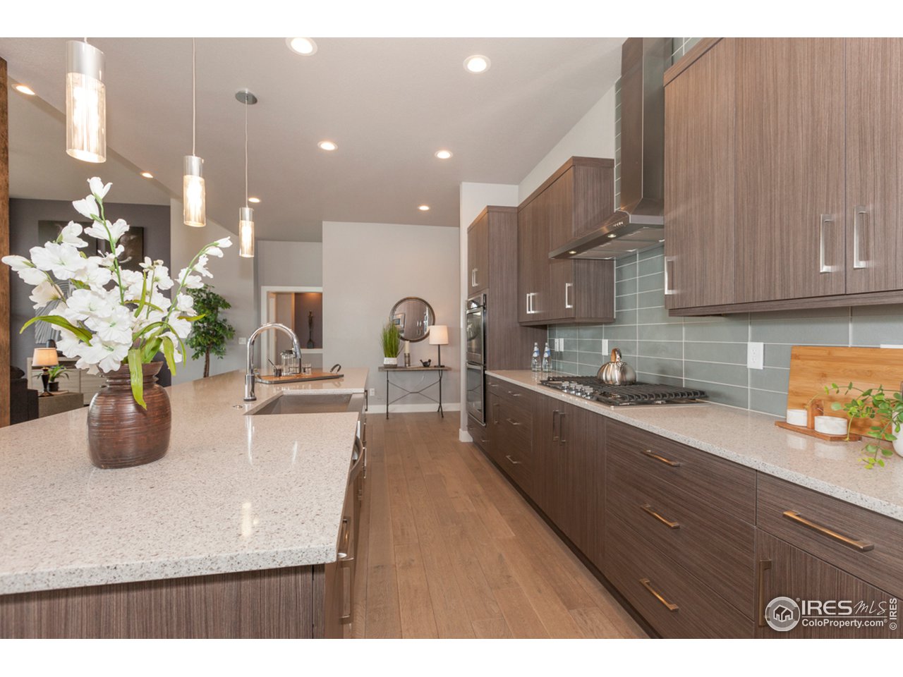 3818 Bridle Ridge Circle Fort Collins, CO 80524 - Photo 9 of 40 a kitchen with counter top space a sink and cabinets
