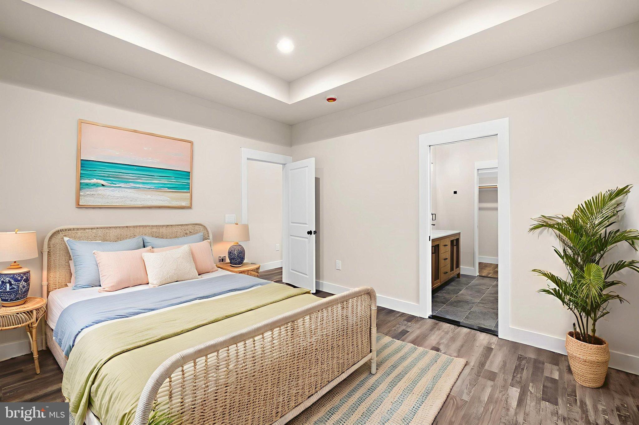 316 9th Street Colonial Beach, VA 22443 - Photo 6 of 59 a bedroom with bed and a potted plant