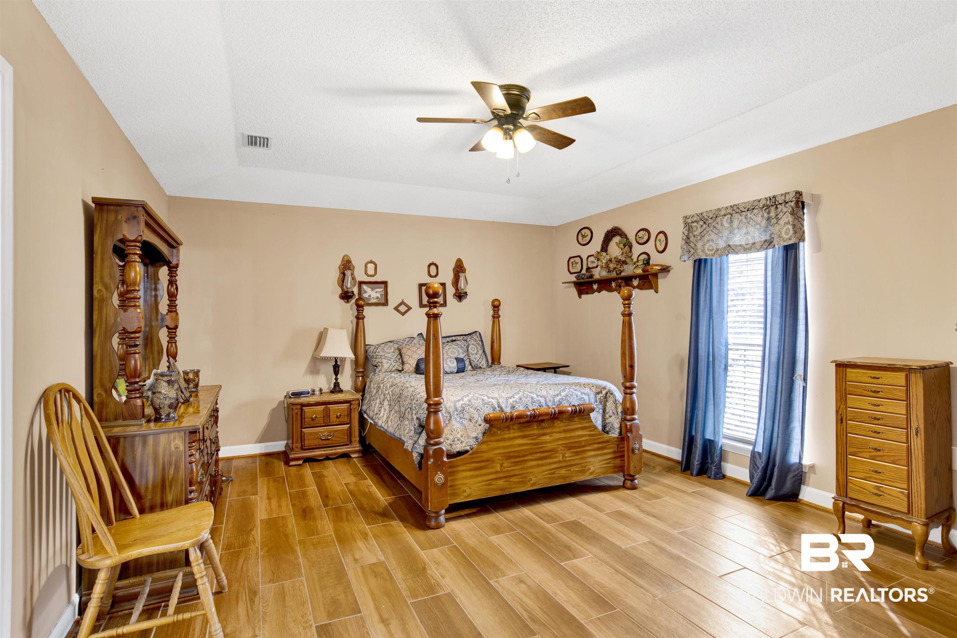 36434 Alexandria Trail Stapleton, AL 36578 - Photo 7 of 27 Bedroom with wood tiled floors and a ceiling fan