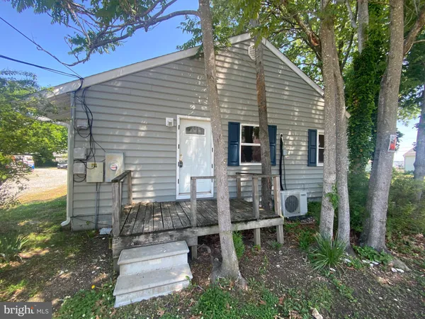 a front view of a house with stairs