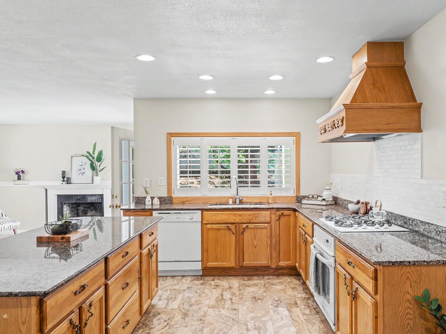6455 Kensington Place Gilroy, CA 95020 - Photo 10 of 32 a kitchen with a sink stove and cabinets