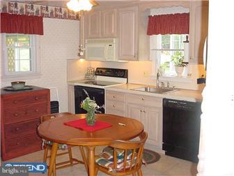 139 Buckwalter Road Pottstown, PA 19465 - Photo 3 of 8 a kitchen with a stove a sink and a refrigerator