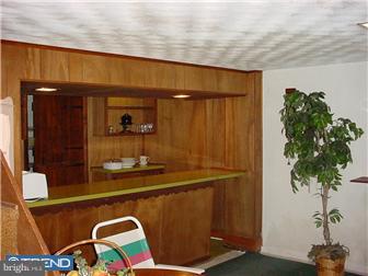 139 Buckwalter Road Pottstown, PA 19465 - Photo 8 of 8 a room with furniture a potted plant and a large mirror