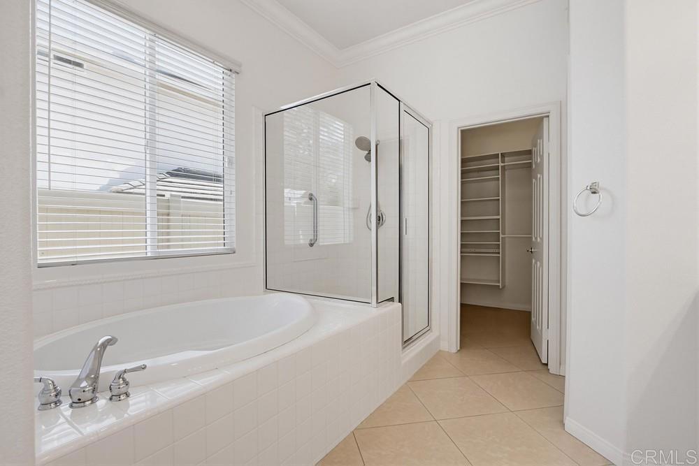 672 Inverlochy Drive Fallbrook, CA 92028 - Photo 35 of 75 a bathroom with a bathtub and a shower