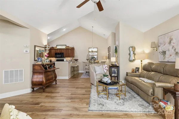 a living room with furniture and a rug
