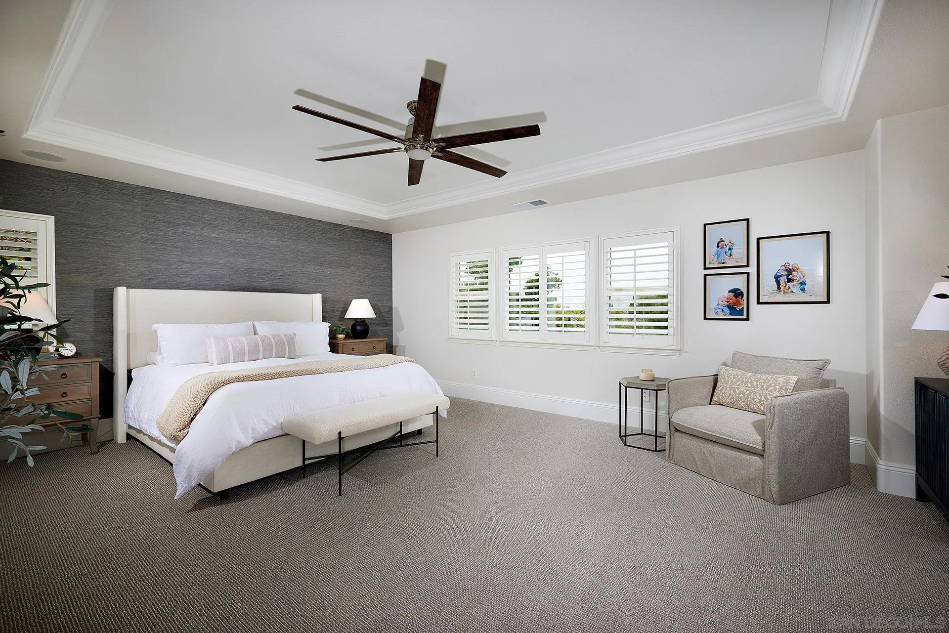 3501 Corte Romero Carlsbad, CA 92009 - Photo 17 of 48 a spacious bedroom with a bed a couch and a window