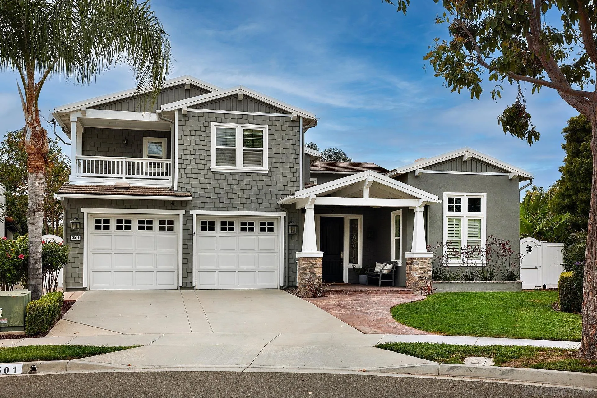 3501 Corte Romero Carlsbad, CA 92009 - Photo 3 of 48 a front view of a house with a garden