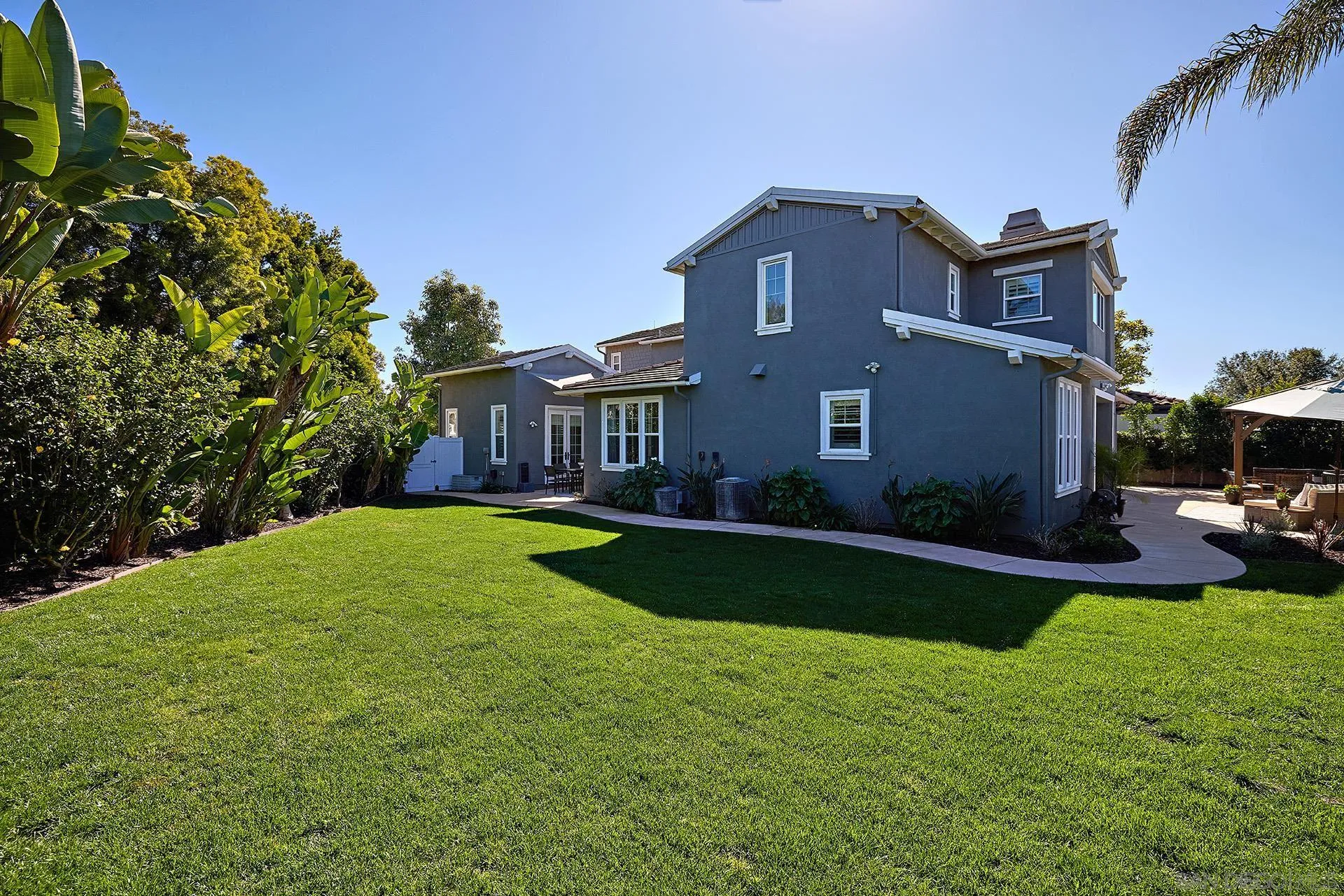 3501 Corte Romero Carlsbad, CA 92009 - Photo 39 of 48 a view of a big house with a big yard plants and large trees