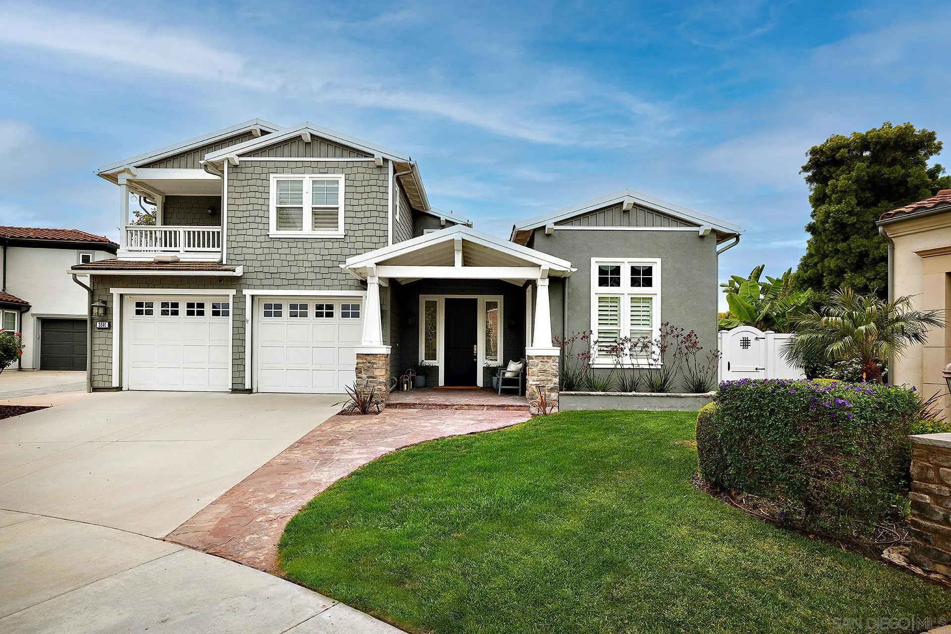 3501 Corte Romero Carlsbad, CA 92009 - Photo 4 of 48 a front view of a house with a yard and garage