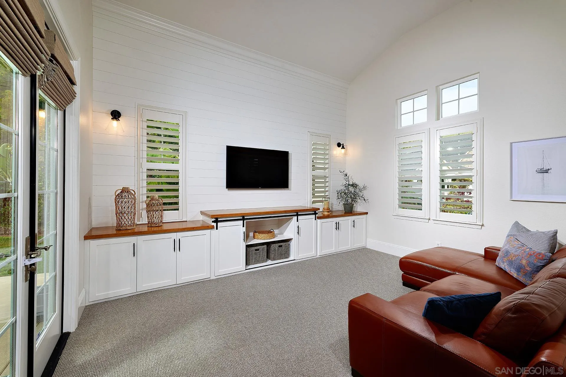 3501 Corte Romero Carlsbad, CA 92009 - Photo 6 of 48 a living room with furniture and a flat screen tv