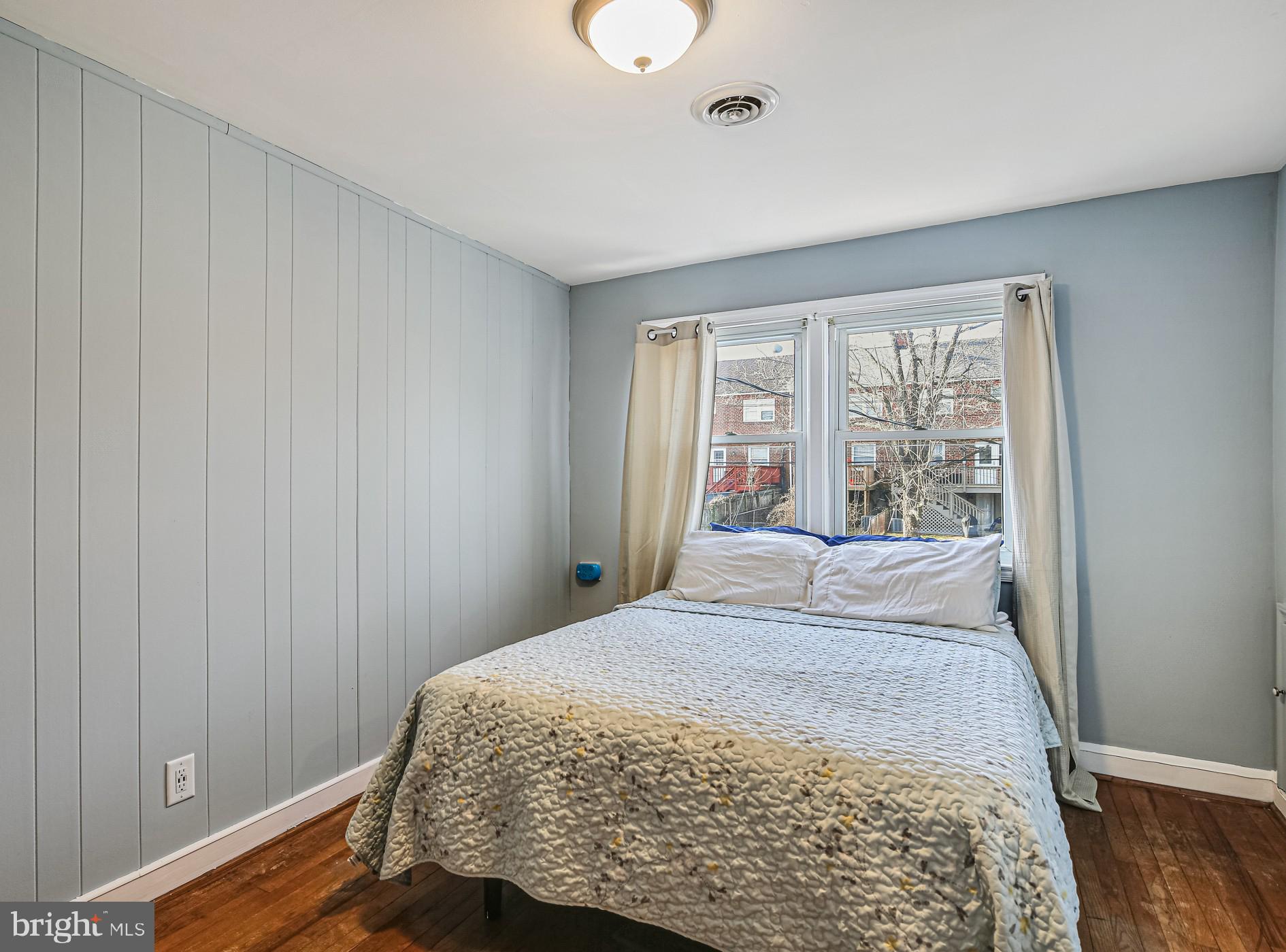 1027 Elm Road Baltimore, MD 21227 - Photo 5 of 36 a bedroom with a bed and a window