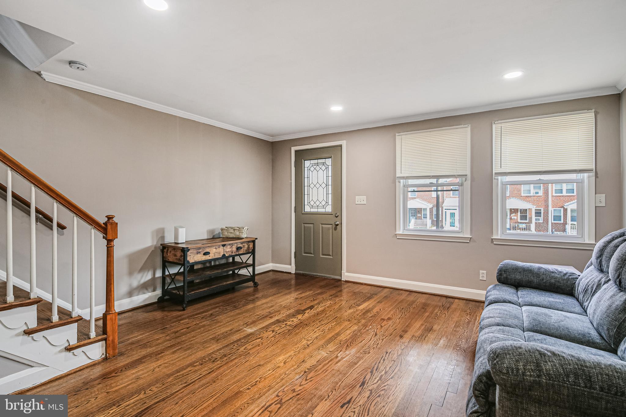 1027 Elm Road Baltimore, MD 21227 - Photo 9 of 36 a living room with furniture and a wooden floor